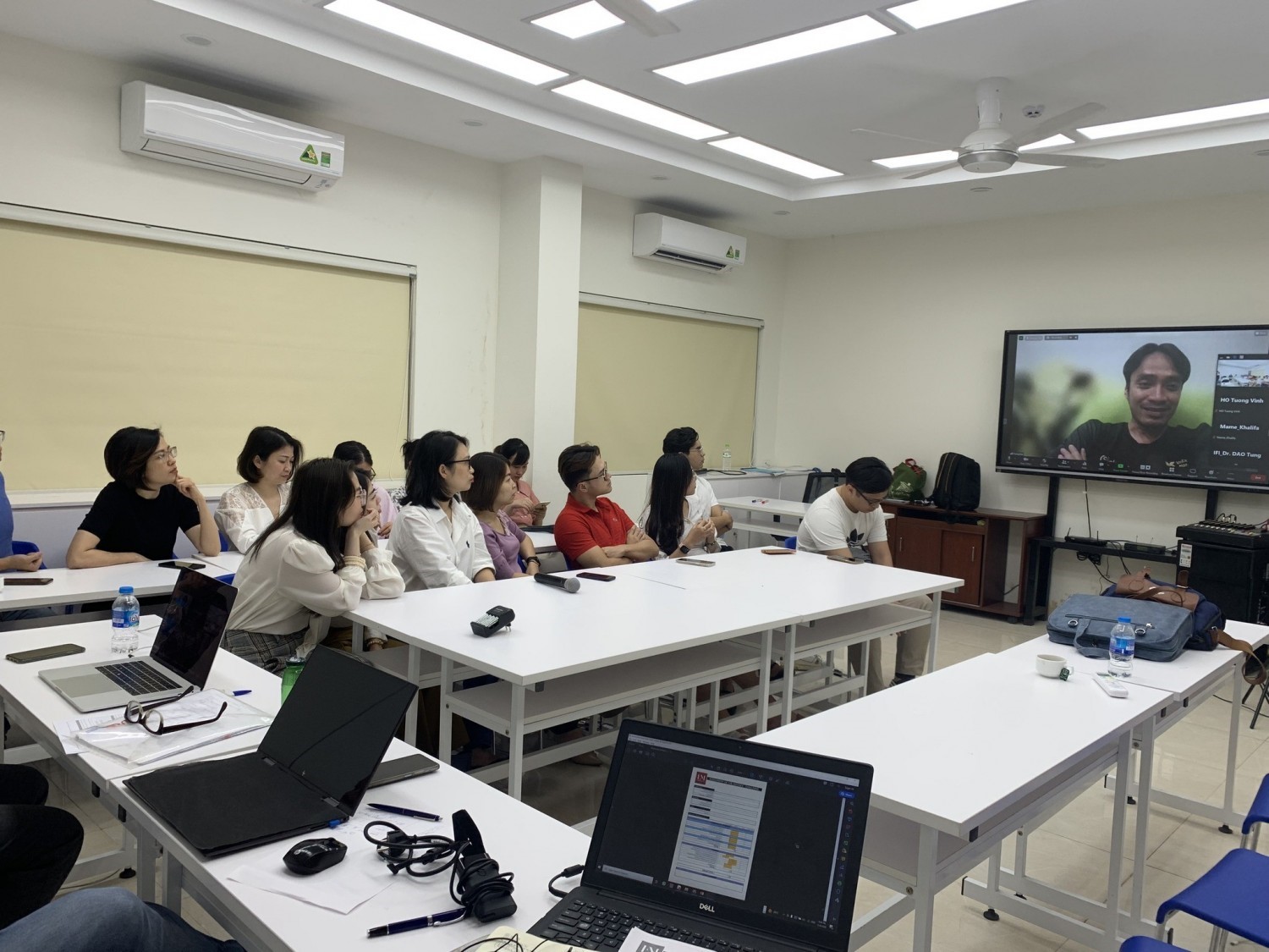 Students listening to the assessment from the business representative